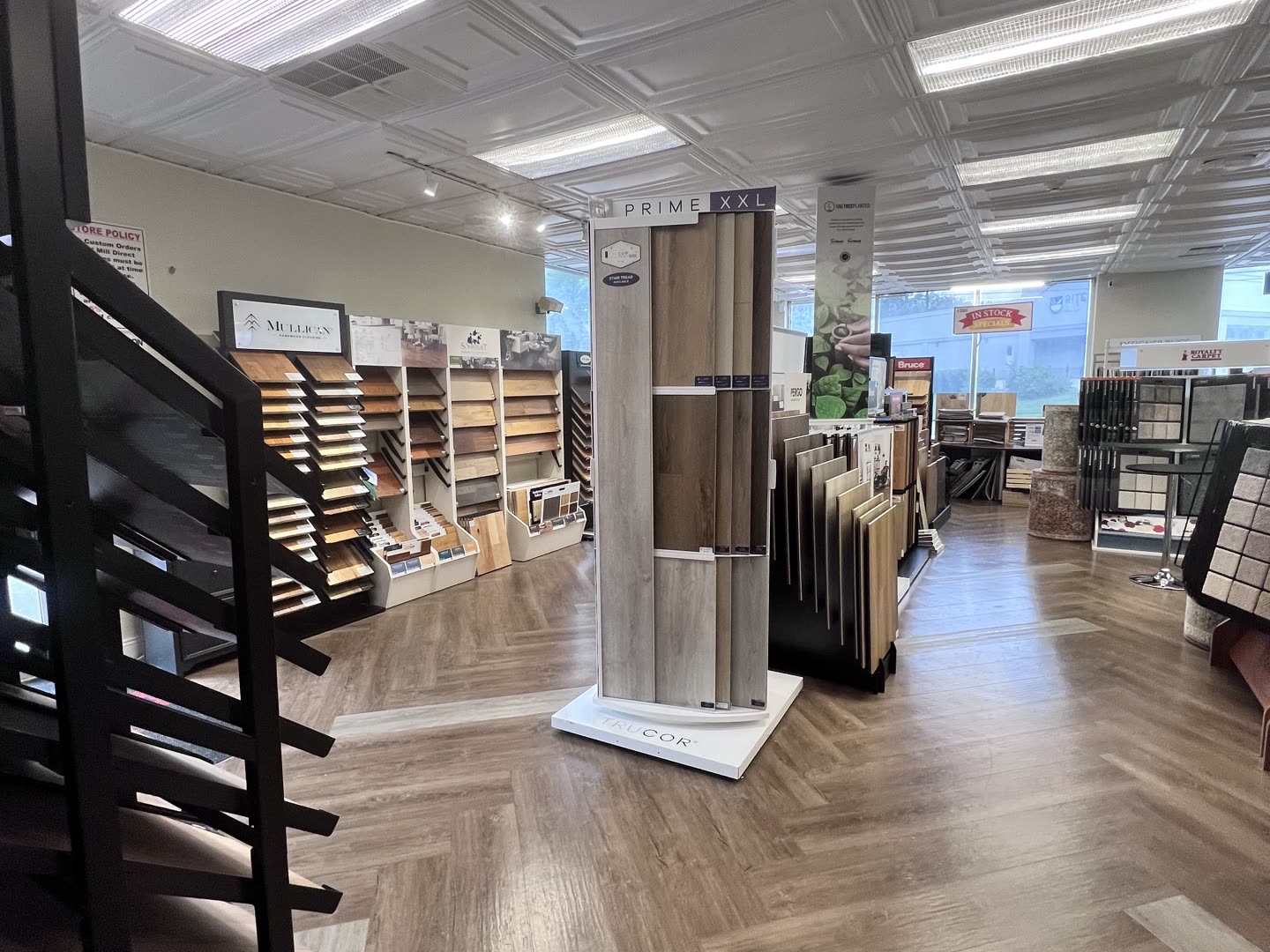 Luxury vinyl plank sample racks at the Royalty Carpet & Flooring showroom in Wappingers Falls