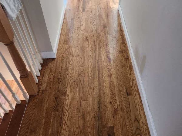 Refinished hardwood staircase and hallway