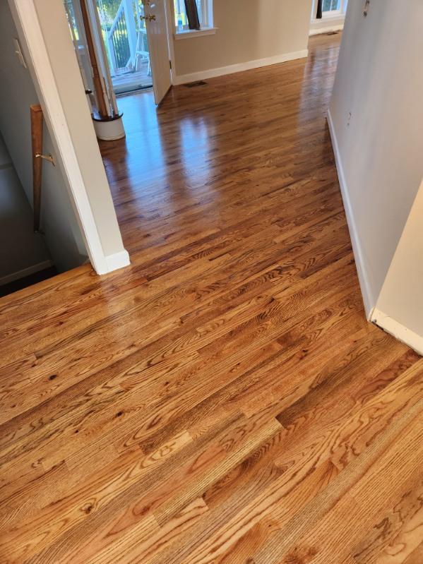 A freshly refinished glossy hardwood floor in a Hudson Valley home by Royalty Carpet & Flooring